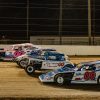 Buzzie Reutimann and David Reutimann driving their DIRTcar UMP Modifieds around Volusia Speedway Park before the start of the 2022 Reutimann Memorial main event